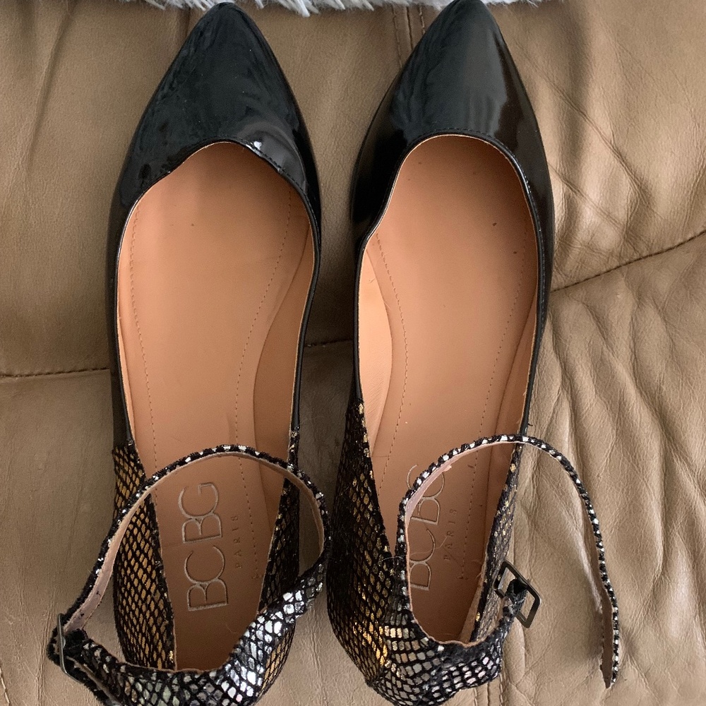 BCBG Beautiful Flat Black Shoes with gold detail on heal. Size 10